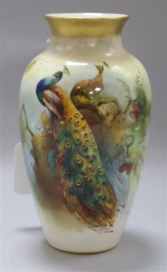 A Royal Worcester baluster vase painted with a peacock, H 17.5cm